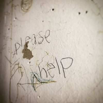 graffiti seen in classroom: "please help"