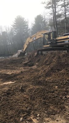 Our Cat 330BL Excavator, used to move large amounts of material and to dig deep in the ground.