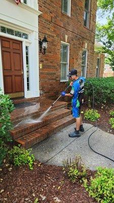 Pressure washing a front porch in Brentwood TN