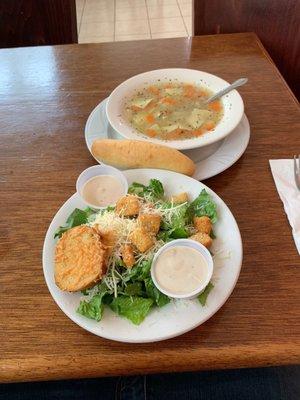 Caesar salad and bowl of chicken noodle soup