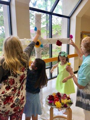 Bringing the beauty of flowers onto the cross on Easter Sunday.