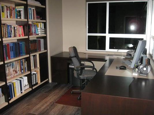 Custom home office in walnut and maple .