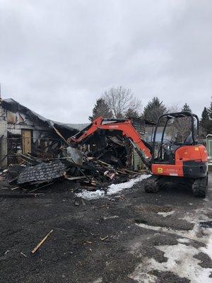 Garage torn down with our excavator!