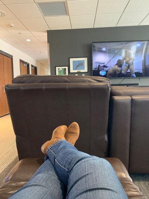 Comfy recliner, tv, snacks, and super clean bathrooms. A wonderful place to rest between flights!