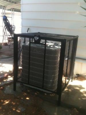 A condenser security cage installed by Paradise Air.