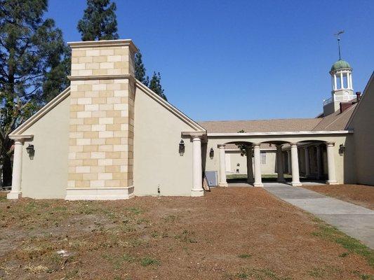 Columns and precast tiles on wall.