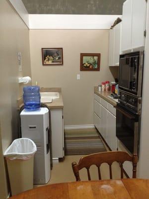 Full kitchen facilities with dishes and full size refrigerator.