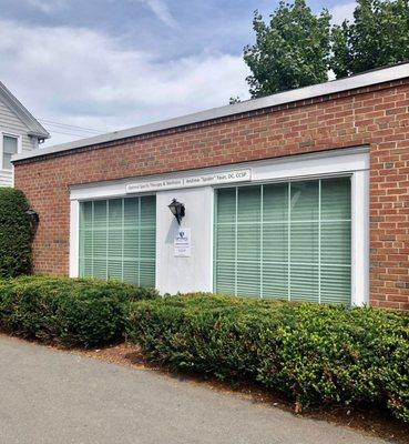 Stand alone brick building located directly behind Key Bank.