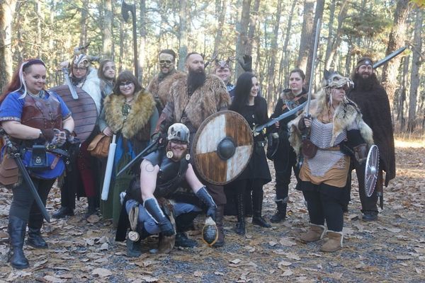 Band of Viking themed LARPers or roleplayers posing