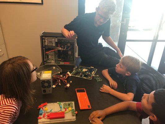 Students learning about the parts that make up a computer.