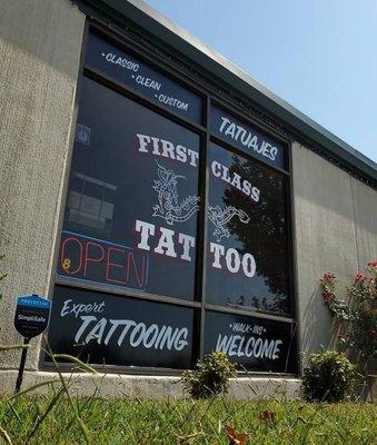 Hand-painted lettering and artwork on our front windows.