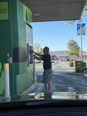 Lol. Using the drive-through ATM when there is a perfectly good walk up ATM on the other side