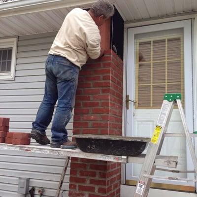 Chimney repair being done by Sunrise roofing and chimney