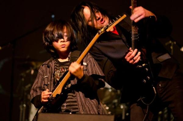 Jamming on stage with 10 year old student Felix Bosquez.