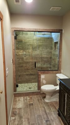 New bathroom installed in basement of home. Not a typical lighting or electrical job but enjoyed doing the framing and tiling.