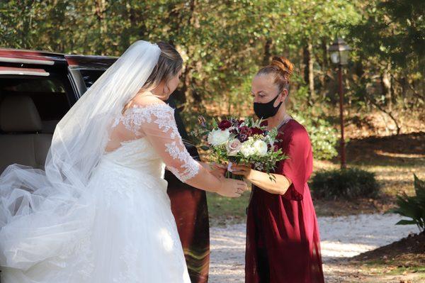 Robin the owner helping bride out before the ceremony.