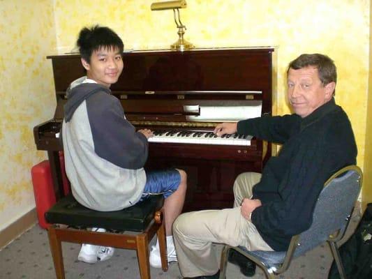 Lawrence, who passed ABRSM Grade 8 Exam., with teacher Alexander. See www.sfmusiccityacademy.com for more photos.