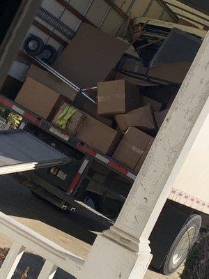 Notice the TV tossed haphazardly on top of other items. This truck was full of multiple customers items.