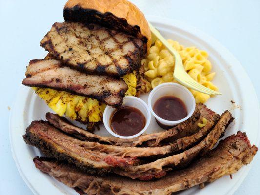 Pineapple express sandwich. Pork belly, pulled pork and grilled pineapple with a side of brisket and some mac and cheese. Legendary.