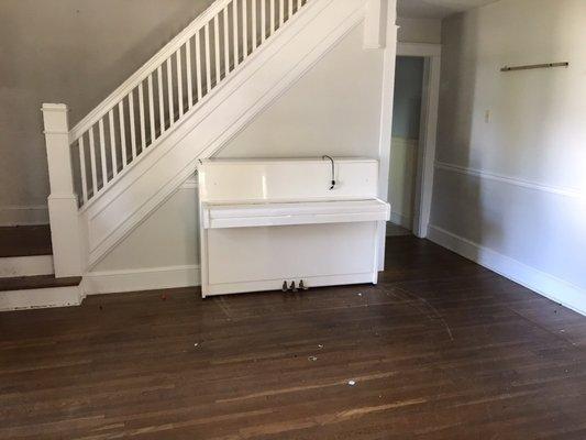 Piano left behind by Movers & Co