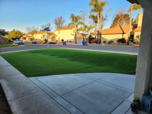 Artificial turf and concrete installed in our front yard to extend the patio and provide a large amount of play space for the kids