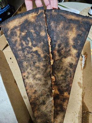 Burnt pepperoni pizza slice