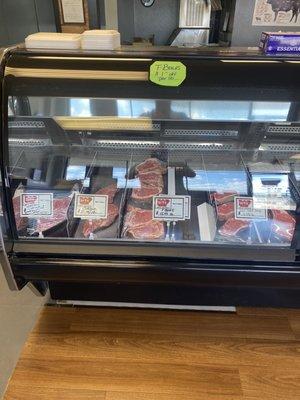 Meat counter.  Everything behind glass and under plastic wrap.  Nice!