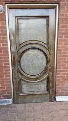 BEFORE: Damaged, weathered door.