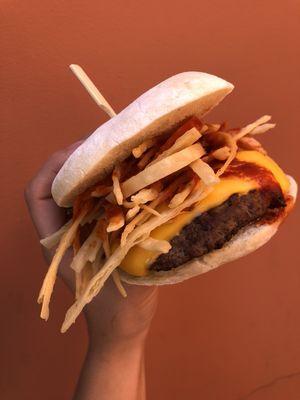 Crunchy Barrio Burger:
1/4 pound patty, queso americano, tortilla strips, onions, barrio guajillo sauce