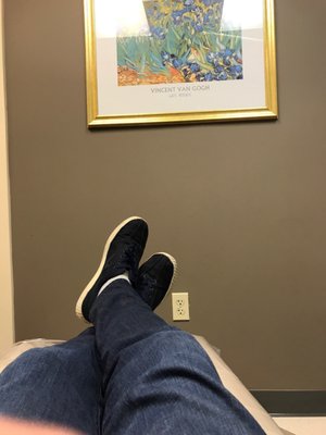 Sitting in dental chair.