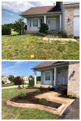 Brick paver border edging with brown mulch installation