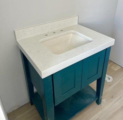 White quartz vanity with a laminated edge!