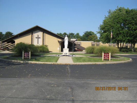 Our front entrance with visitor parking and view of the chapel on the left.