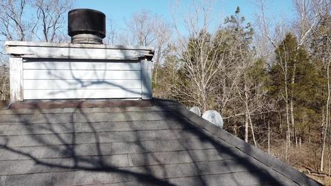 Note water damaged wood around the chimney.