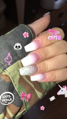 Pink to white ombré with a glitter accent nail and matte top coat