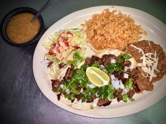 Asada taco plate served with rice and beans.