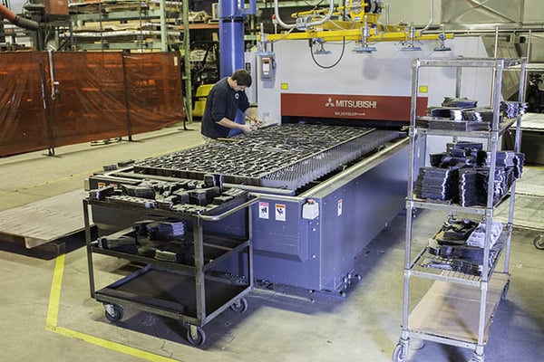 Josh operates the new Mitsubishi laser in the welding department.