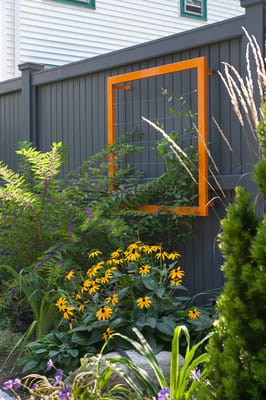 Colorful trellis frames make this garden feel modern.