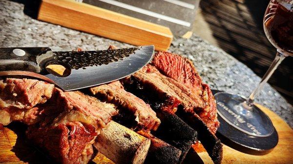 Savage and fantastically delish BBQ short ribs  created on a rustic grill - experience the magic of short rib BBQ heaven!