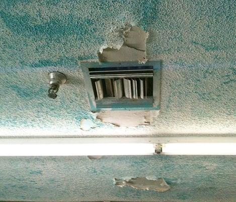 Popcorn ceiling coming down around the vents.