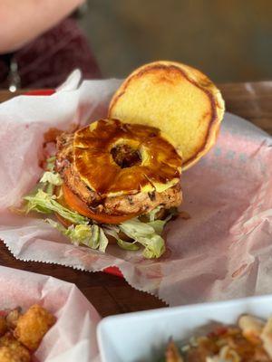 Hawaiian chicken sandwich with lettuce, pineapple, and tomato