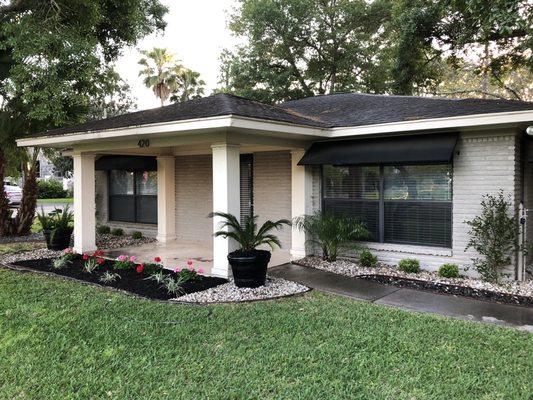 Beautiful flower bed with black mulch and a second desert flower bed.