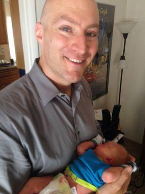 Attorney Daniel Reed with new born.