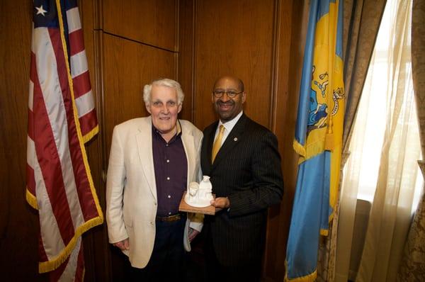 Joe Winter presenting replica of his sculpture in Three Bears Park to Mayor Nuitter.  For sales:  www.winterartstudio.com.