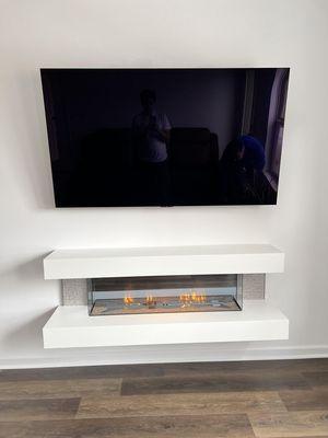 Bringing warmth and entertainment together: Electric fireplace and TV installation