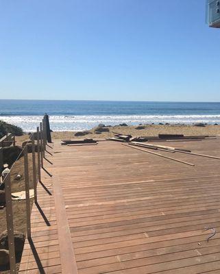 Beach house with a beautiful wooden deck stretching out to the waters of Malibu. Another one by Stonebridge