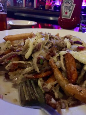 Poutine - it was delicious. Had crunchy bacon and yummy pulled pork. And white gravy(?) crunchy fries too! Try it!!