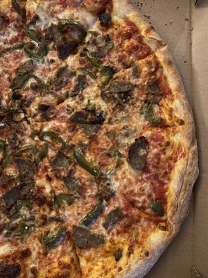 Large cheese pizza with meatball and green pepper