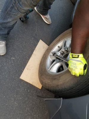 Making sure to properly torque customer's lugnuts to manufacturers specifications during tire change in Salt Lake City, Utah.