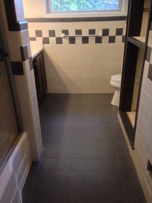 Same bathroom with charcoal colored stone look. Colored checker pattern was chosen to match the floor